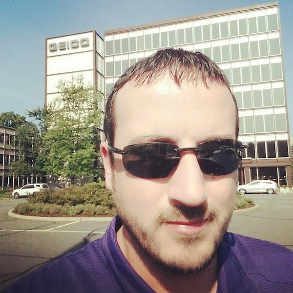 Eric Ryckman outside a GEICO office during his years with the company